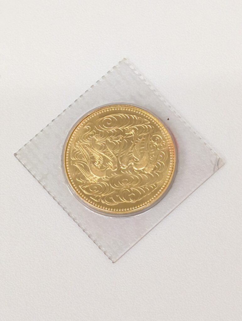 天皇陛下御在位60年記念 10万円金貨